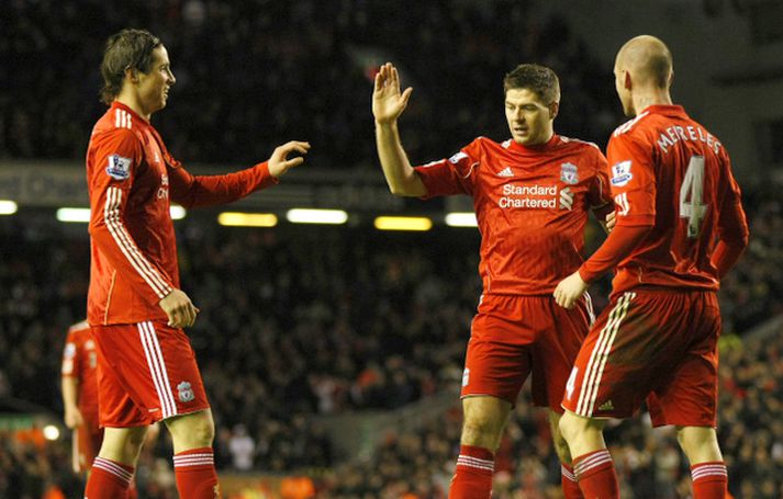 Voru samherjar en mætast mögulega sem andstæðingar á sunnudaginn. Torres er lengst til vinstri en með honum á myndinni eru Steven Gerrard og Raul Meireles.