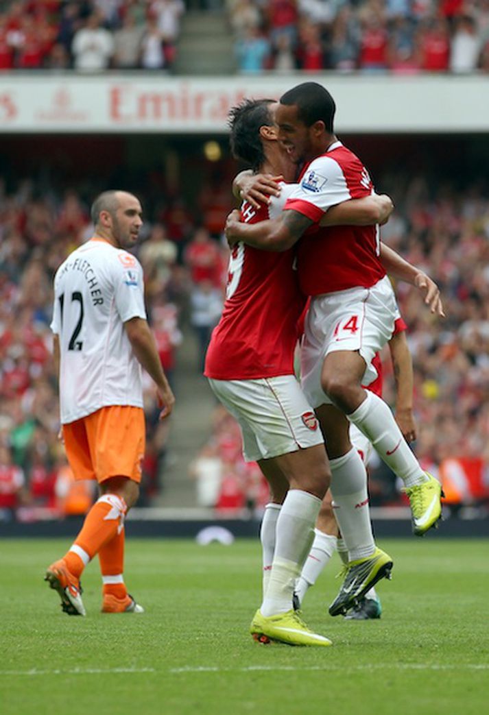 Walcott fagnar fyrsta marki sínu.