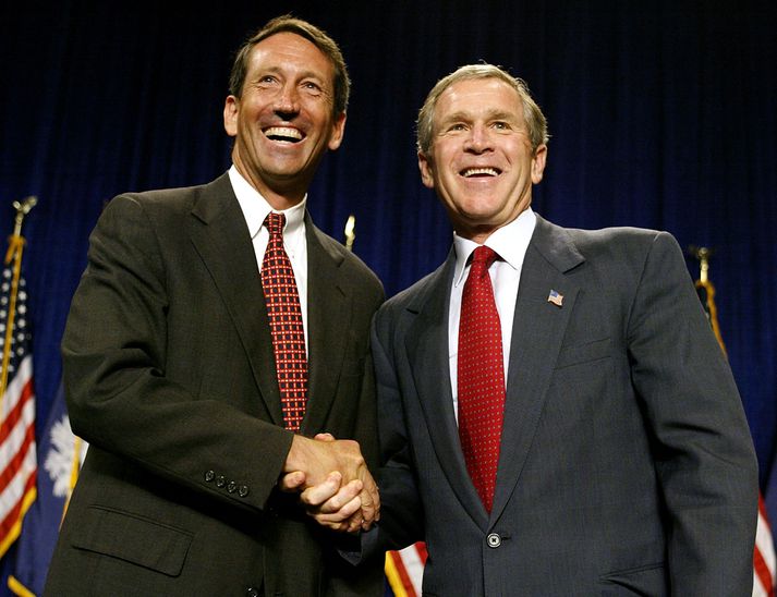 Mark Sanford, hefur vikið ráðherranum úr embætti. Hér er hann með Bush Bandaríkjaforseta.