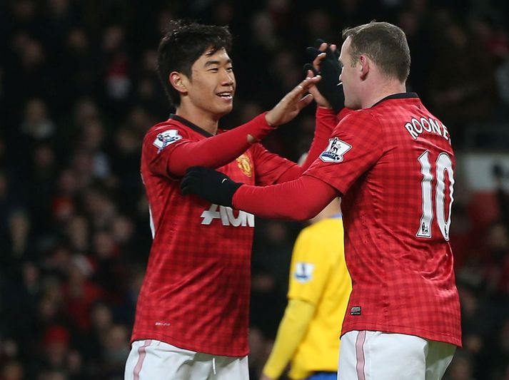 Kagawa fagnar með Rooney.
