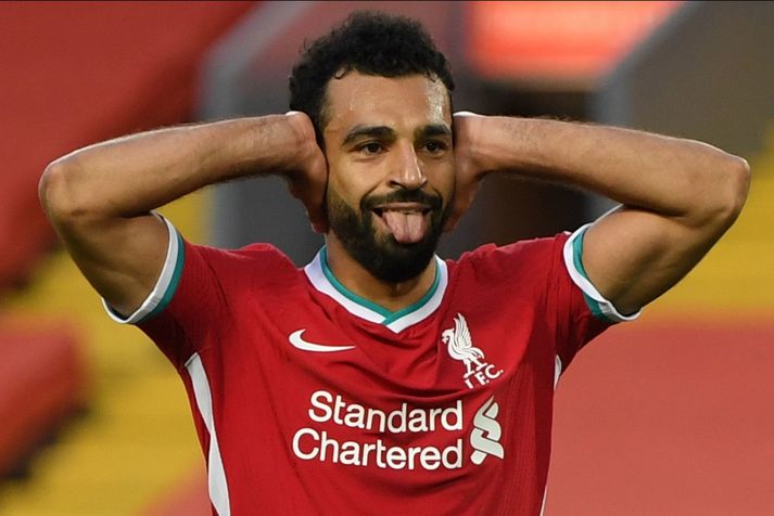 Mohamed Salah fagnar marki með Liverpool.