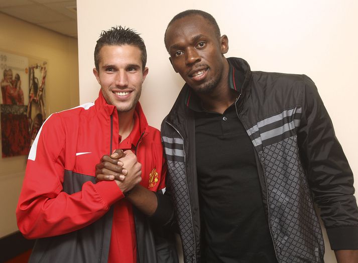 Bolt er hér með Robin van Persie er Van Persíe lék með United.