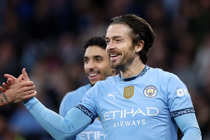 Jack Grealish brosti út að eyrum eftir að hafa skorað langþráð mark í gær.