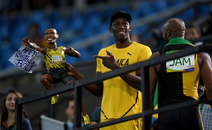 Usain Bolt fékk sjálfan sig að launum eftir hlaupið.