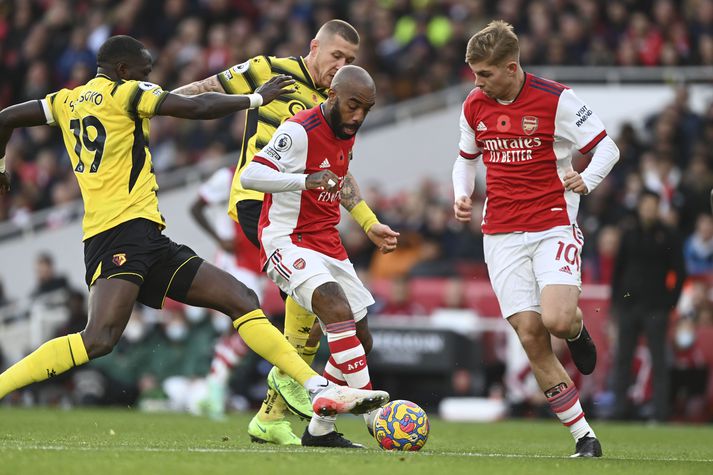 Lacazette og Sissoko berjast um boltann í leik Arsenal og Watford í dag