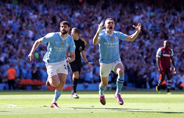 Phil Foden skoraði tvívegis fyrir Manchester City er liðið tryggði sér Englandsmeistaratitilinn.