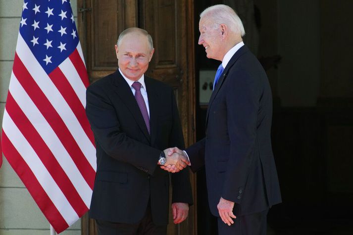 Russian President Vladimir Putin, left, and U.S President Joe Biden shake hands during their meeting at the 'Villa la Grange' in Geneva, Switzerland in Geneva, Switzerland, Wednesday, June 16, 2021. (AP Photo/Alexander Zemlianichenko, Pool)